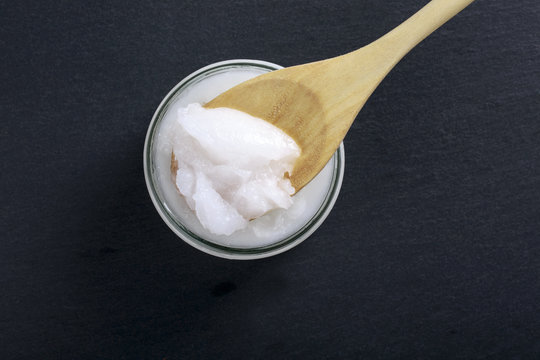 Coconut Oil In A Glass Jar On A Black