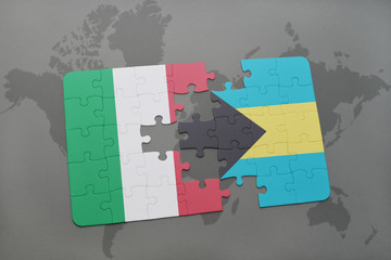 puzzle with the national flag of italy and bahamas on a world map background.