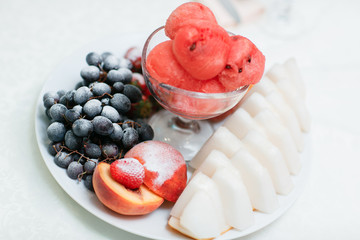 ripe sliced watermelon and melon grapes strawberries