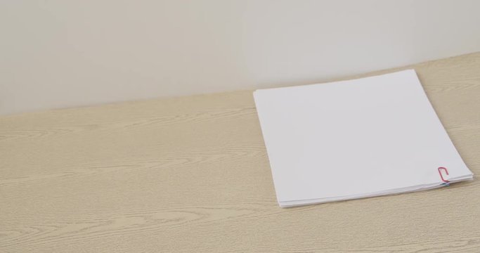 Step pile document place on wood table time lapse