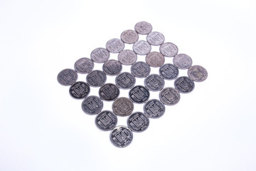 coins of Ukrainian hryvnias on white background