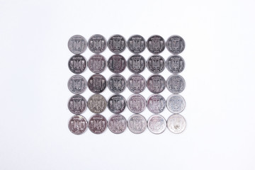 coins of Ukrainian hryvnias on white background