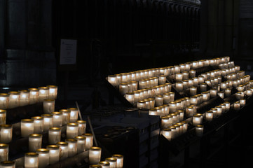 Worshipers Lighting Candles in Church