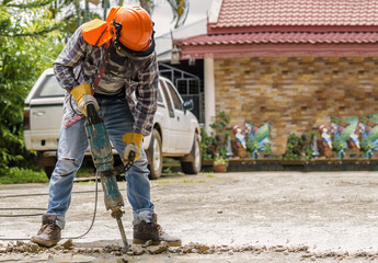 Workers use Concrete Breaker Electric - 115850694
