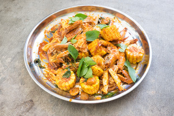 Fried shrimp ,squid and crab with basil with hot and spicy sour,