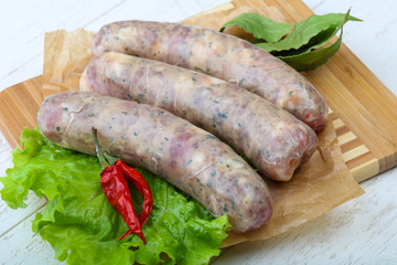 Raw sausages for cooking