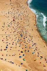 Beach from Above with Many Umbrellas and People