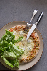 Cheese pizza with salad