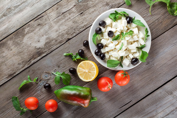 Ingredients for cooking Greek salad. On older boards