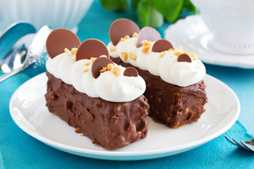 Fototapeta na wymiar Chocolate cake with caramel, peanut cream 