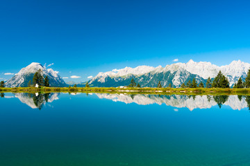 Mountains reflecting in lake water