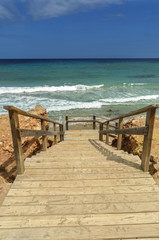 Fototapeta na wymiar stairs to the beach Ibiza,balearic Islands,Spain