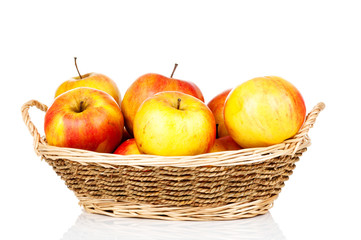 Fresh apples in the wicker on white background