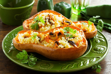 Pumpkin stuffed with couscous with grilled mushrooms.