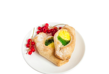 Bake isolated. Scones with jam on a plate. Pastry sprinkled with chocolate. Red currant.