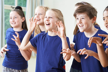 Group Of Children Enjoying Drama Class Together