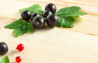 organic garden berries on old wood table, from above