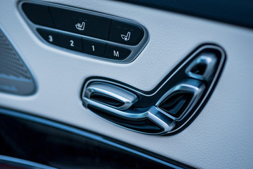 Naklejka premium Luxury car interior. Door, seat and window controls
