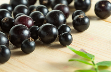 border of fresh berries mix on wooden tabletop