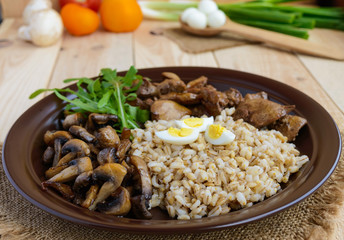 Barley porridge, fried mushrooms and duck liver, boiled quail eg