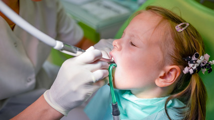 Healthy teeth patient girl at dentist office dental caries prevention