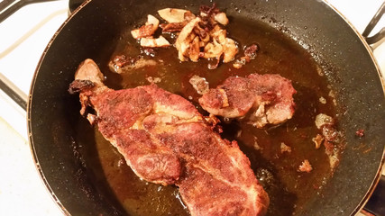 Roasted meat on a frying pan