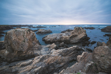 Fototapeta na wymiar Glass beach landscape with cliffs and ocean.