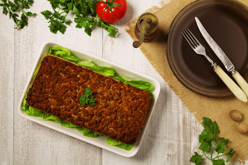 Homemade meat pie with vegetables, served with cranberry sauce