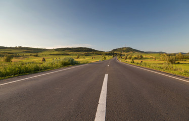 Fototapeta na wymiar Empty country road, in Sibiu county, Transylvania, Romania