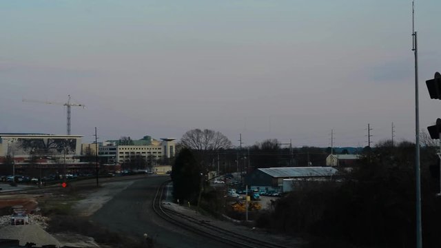 Downtown Raleigh Skyline at Sunset with train tracks and industrial foreground
