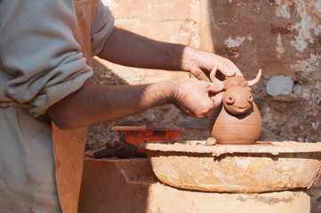 Potter working the clay making a torus-MASCARELL, SPAIN - NOVEMB