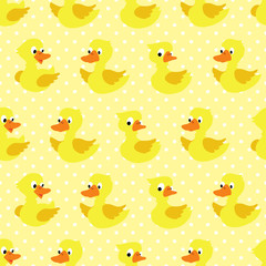 Seamless pattern with duckling on yellow dotted background.