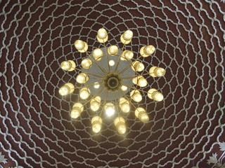 Beautiful chandelier on a background of oriental design. Dubai