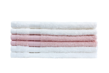 Stack of white and pink bath towels isolated over white background.