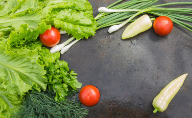 lettuce with dill, parsley, tomatoes and green onions closeup