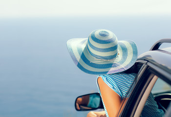 Relaxed happy woman on summer roadtrip travel vacation looking a
