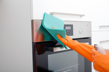 Housework. Tidying up and cleaning the kitchen.