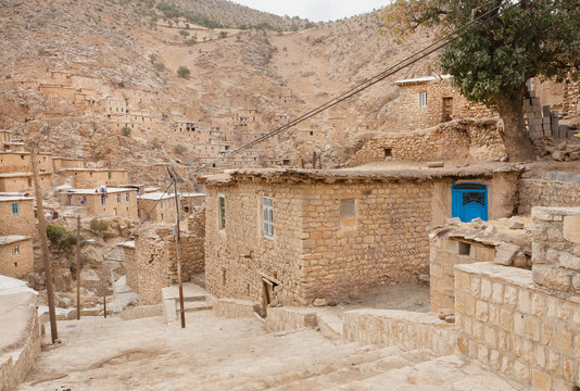 Rural landscape with brick houses in mountain village Palangan, Iran
