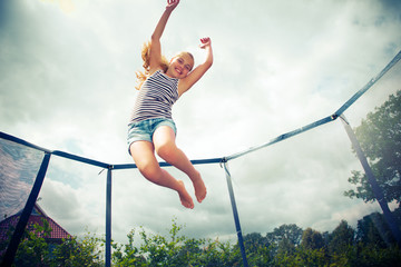 Fototapeta jumping on a trampoline obraz