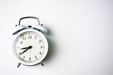 White alarm clock isolated on white background