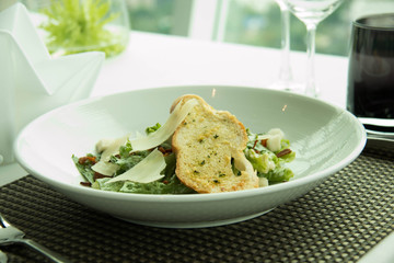  caesar salad with lettuce and garlic bread