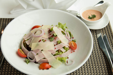  salad with lettuce,cheese, tomato, and ham
