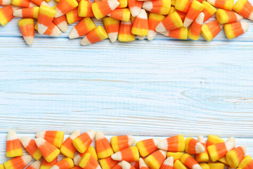 Halloween candy corns on blue wooden background