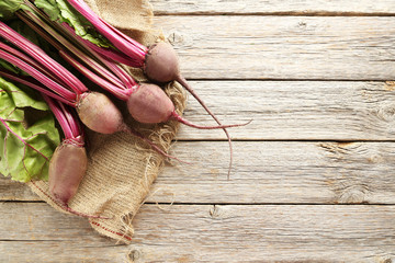 Fresh beets on a grey wooden table