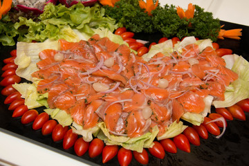   salmon gravlax on a black  dish.
