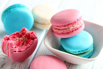 Tasty french macarons on a blue wooden table