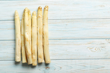 Fresh white asparagus on a blue wooden table