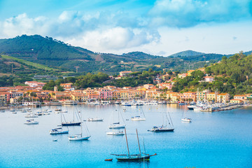 Beautiful panoramic view over Porto Azzurro village at sunset, in Elba island, Italy