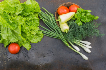 lettuce, lemon and a basket with tomato, pepper, dill and parsle