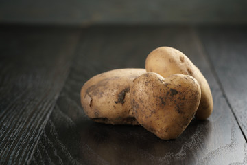 heart shaped potatoes on black oak table